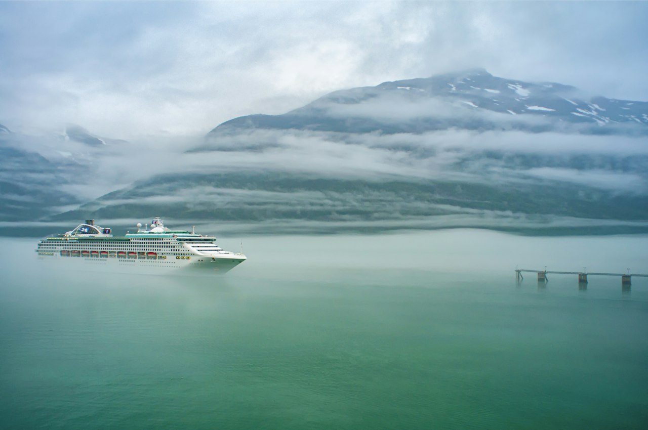 Celebrity Cruises ship sailing through Alaska glaciers for niche cruise travel marketing