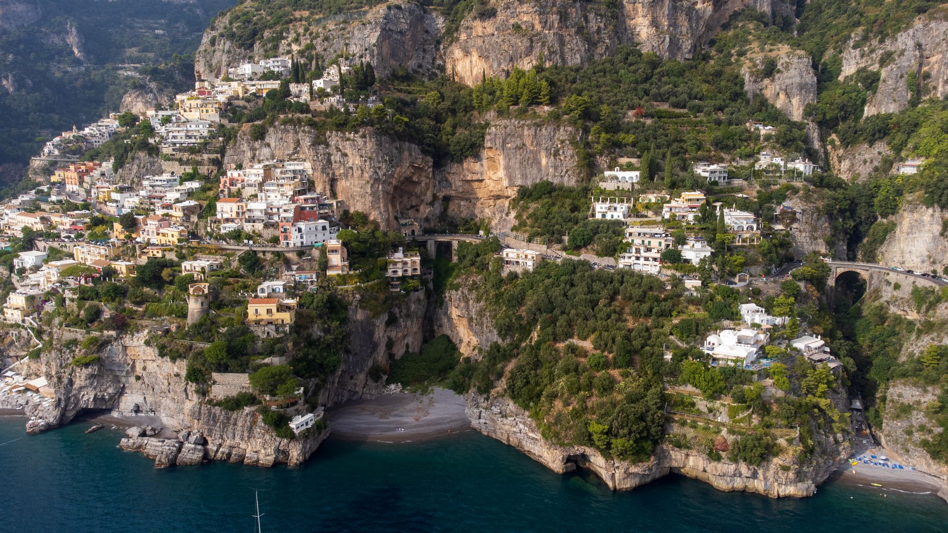 Luxury couple enjoying bespoke Amalfi Coast vacation booked by a travel advisor on Facebook
