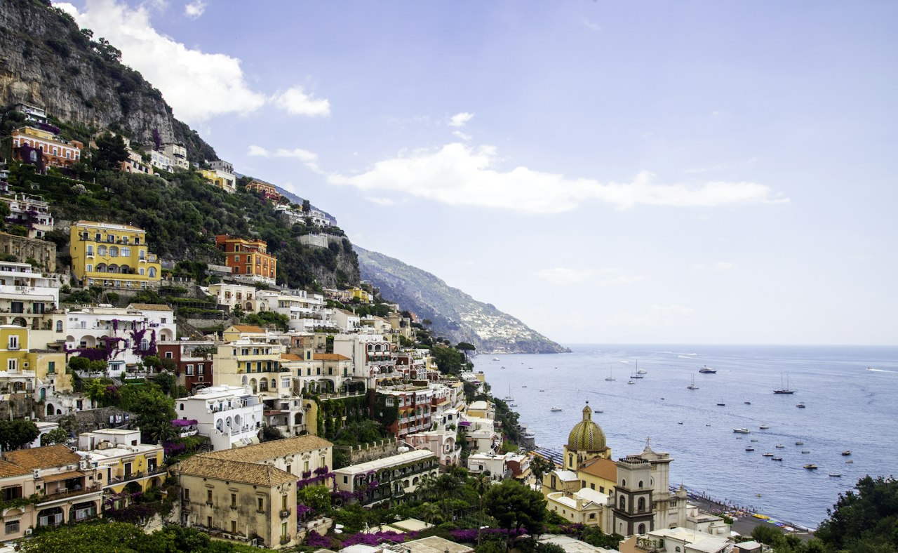 Independent luxury travel advisor traveling along Amalfi Coast enjoying freedom