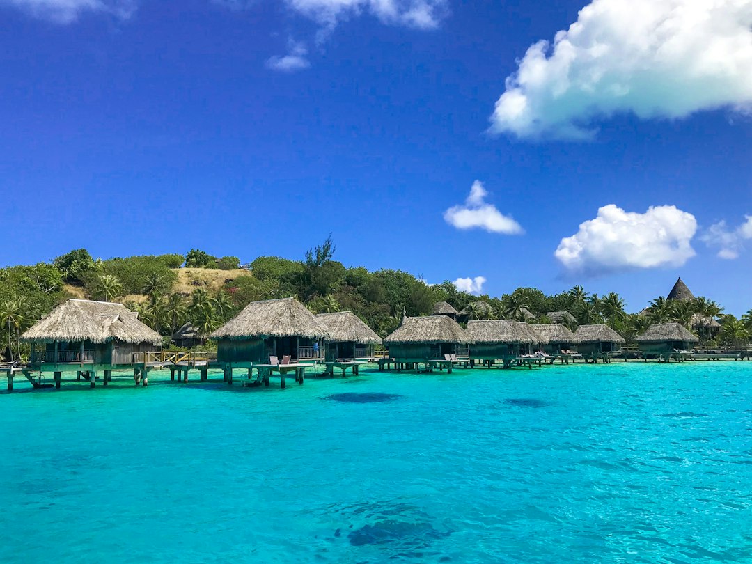 Luxury overwater bungalow with turquoise lagoon in Bora Bora resort review