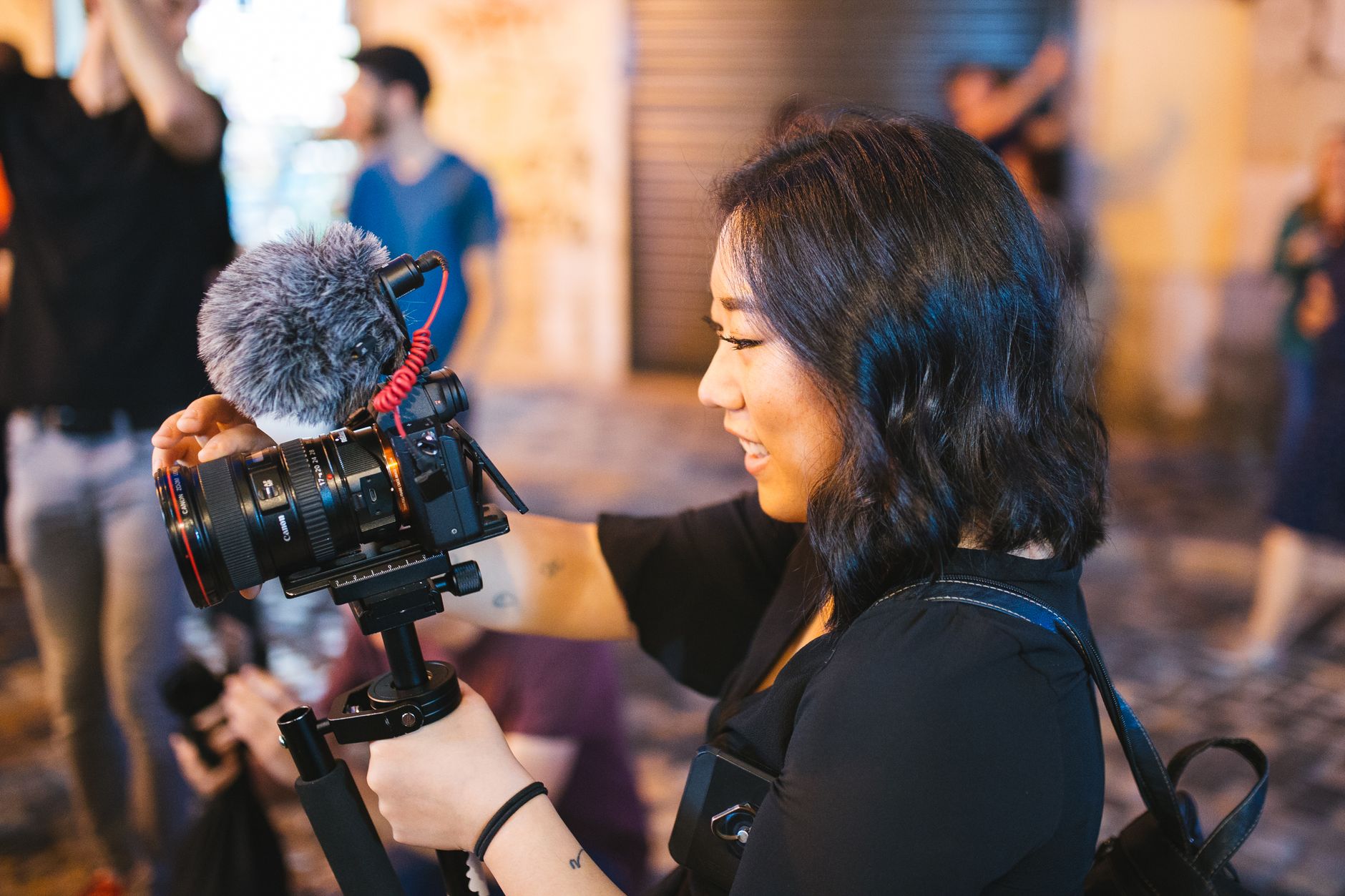 Travel consultant capturing video on camera during luxury property inspection