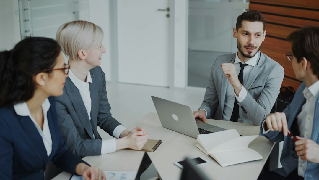 Executive travel agency leadership and advisors collaborating in modern corporate office