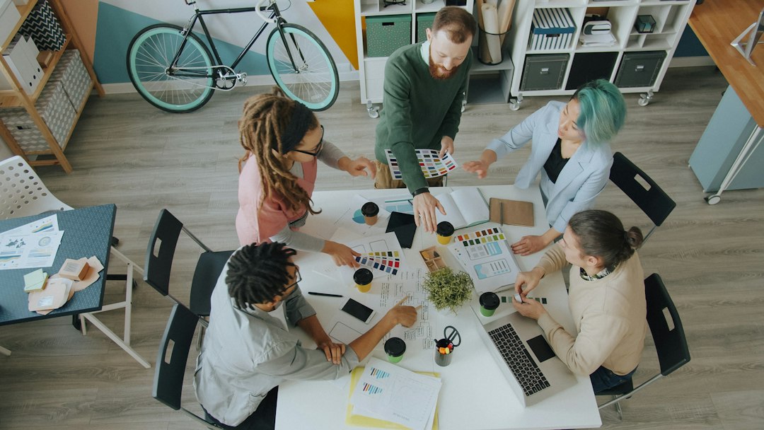 Travel agency host network leadership team collaborating in a modern studio
